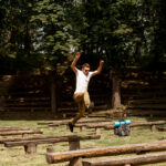 A man executes a dynamic jump on his skateboard, capturing the thrill of extreme sports in an urban landscape.