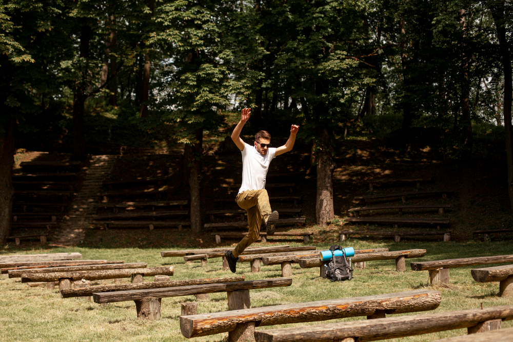 A man executes a dynamic jump on his skateboard, capturing the thrill of extreme sports in an urban landscape.