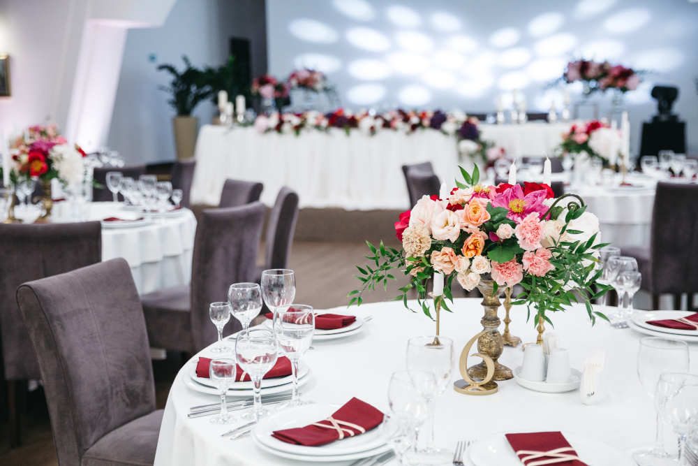 Elegant wedding reception setup featuring beautifully arranged tables and chairs, perfect for memorable celebrations.